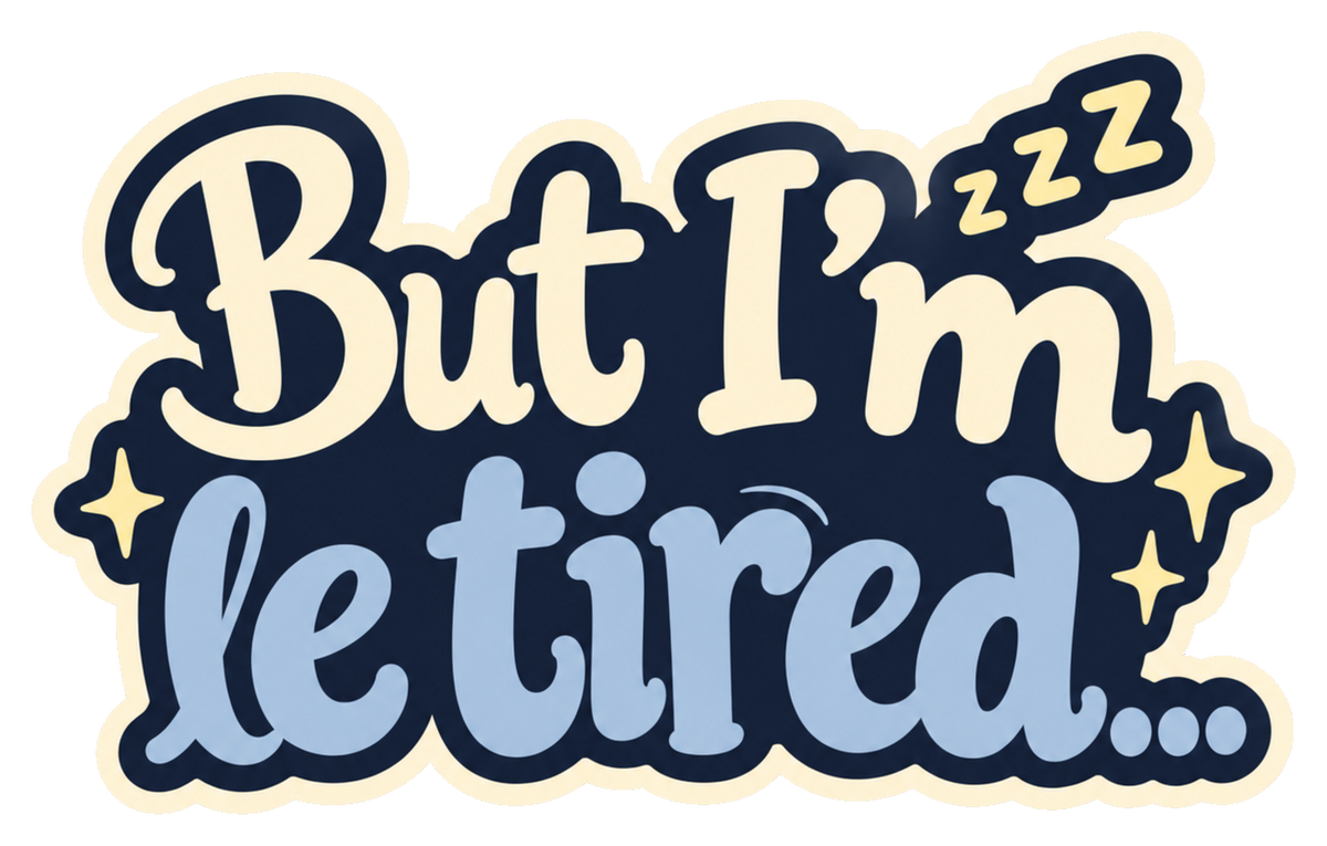 But I’m le tired... in cream and dusty-blue lettering on a navy shape with small stars and sleepy Zs.