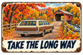 Take the Long Way autumn sticker with a wood-paneled station wagon, colorful leaves, creek, and covered bridge
