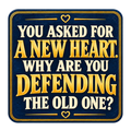 Navy sign-style sticker with gold-colored lettering and heart accents reading You asked for a new heart. Why are you defending the old one?